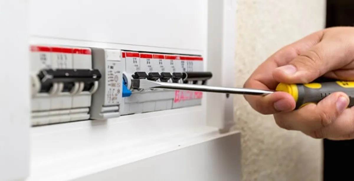 electrical panel upgrade service showing technician adjusting circuit breakers during system upgrade in Myrtle Beach, SC