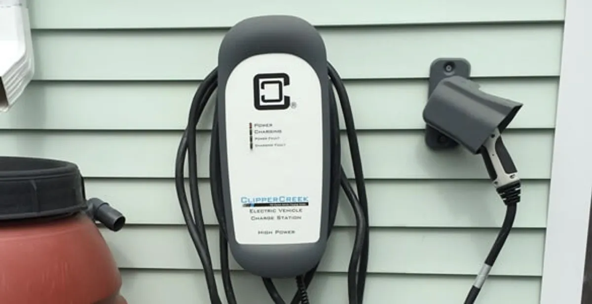 Outdoor electric vehicle charger installation on residential wall in Myrtle Beach, SC
